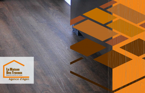 Pose de parquet de qualité à Agen : contraste saisissant entre les nuances boisées du sol et la modernité des équipements de cuisine.