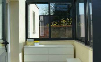 Véranda sur allège maçonnée