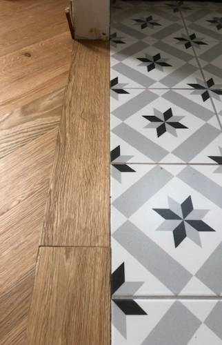 Finition du parquet massif à Clichy