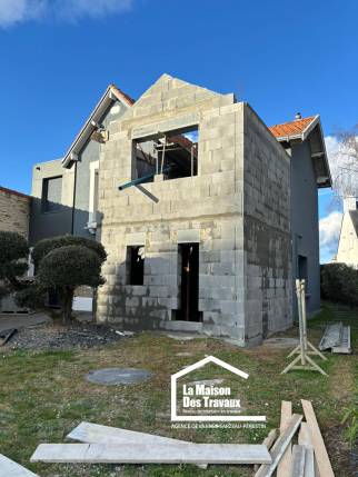 Agrandissement de maison avec harmonie entre ancien et nouveau