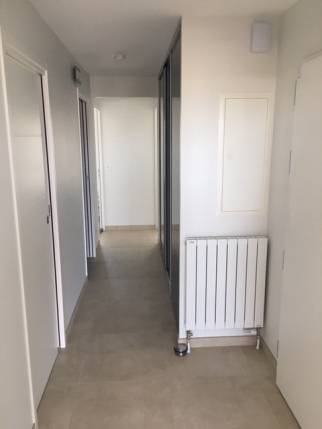 Travaux de remplacement de chauffage - pose d'un radiateur dans le couloir - Nantes 44