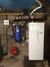 Pompe à chameur air-eau en sous-sol après isolation phonique et mises aux normes électricité/plomberie - Cergy POntoise - 95800 - 