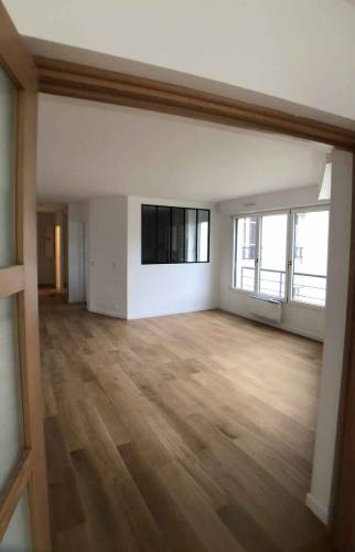 Rénovation complète du salon d'un appartement - La Maison des Travaux Paris