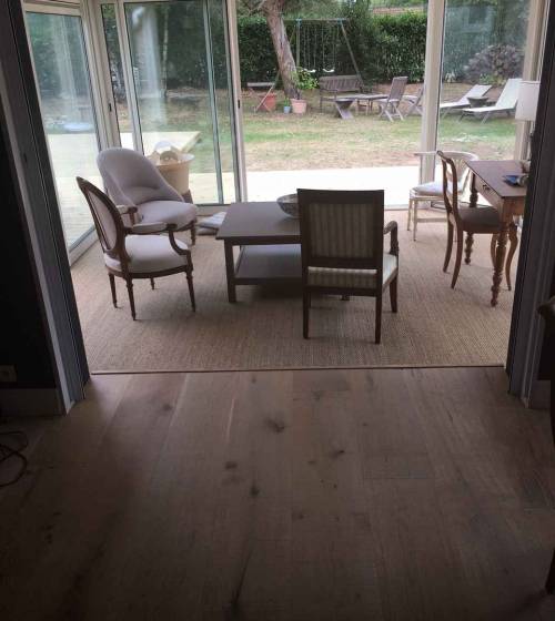 Salon et salle à manger avec son nouveau parquet - Nantes 44