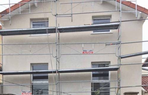 Ravalement en enduit taloché après pose de l'ITE