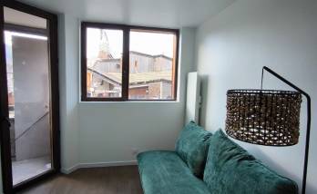 avoriaz-74110-renovation-appartement-sejour-canape-fenetre-porte-fenetre-balcon