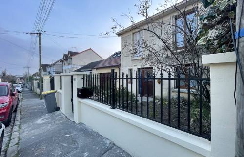 Rénovation de clôture et de revêtement de sol extérieur à Massy