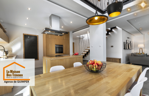 Une vue globale d’une cuisine ouverte sur le salon, créant un espace convivial et moderne. 🍽️🏡