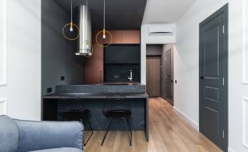 Pièce de vie avec la cuisine comme élément central - Paris