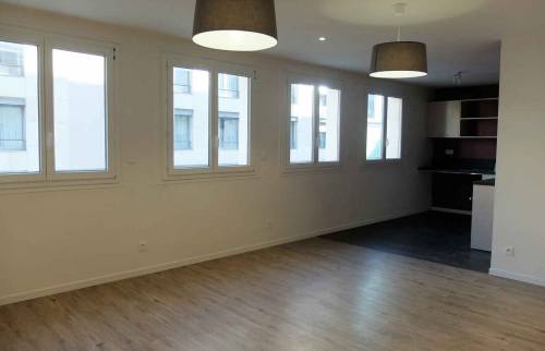 Rénovation complète d'un appartement situé dans Lyon 6° quartier Tête D'Or - vue sur le séjour agrandi