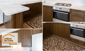 Rénovation de cuisine à Marmande : meubles en bois massif, plan de travail en marbre et électroménager encastré pour un rendu à la fois chaleureux et haut de gamme.