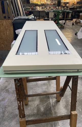 Mise en place du panneau isolant de la porte d'entrée