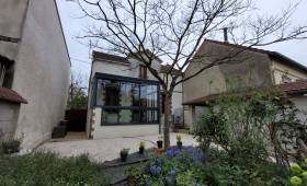 La véranda et les aménagements paysagers