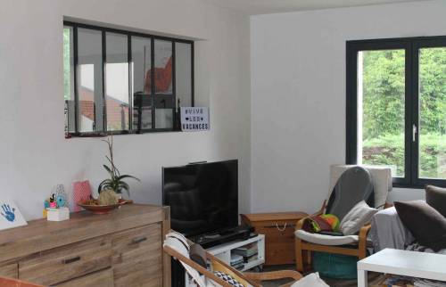 Rénovation d'une maison avec frangement entre le salon et la cuisine et accès par une passerelle à Nantes (44)