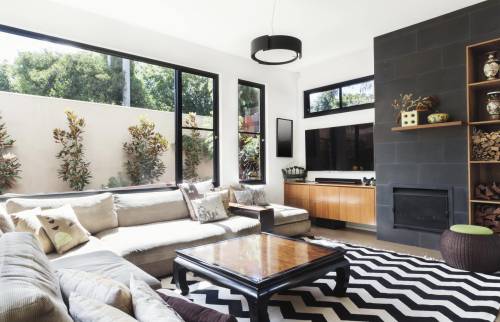 salon moderne véranda vue sur le jardin