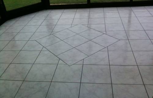 Plancher chauffant reversible revêtement grès cérame dans une véranda - Saint-Ouen-l’Aumône (95310)