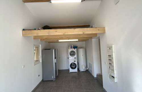 Aménagement garage en buanderie cellier La Maison Des Travaux Ales