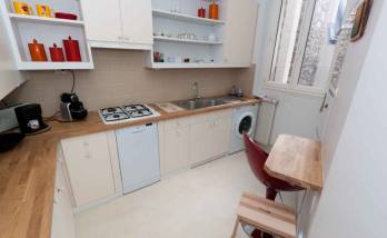 Une cuisine d'angle entièrement aménagée par des artisans de La Maison Des Travaux Boulogne-Saint Cloud