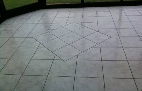 Plancher chauffant reversible revêtement grès cérame dans une véranda - Saint-Ouen-l’Aumône (95310)