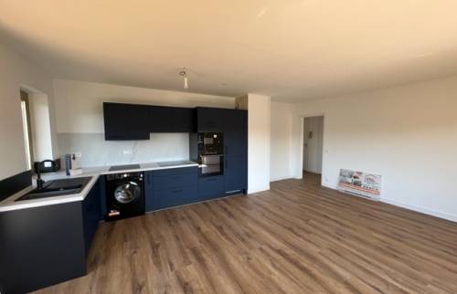 Le séjour avec la cuisine ouverte