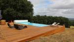 terrasse en bois avec une piscine à rideau sécurisé à Magny-le-Freule (14270)