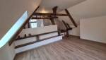 Mise en valeur des poutres pour cet appartement