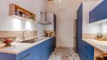 Réalisation d'une cuisine dans les tons bleus avec carrelage terrazzo assorti, appartement type Canut situé à Lyon