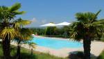 Réalisation d'une terrasse et d'une plage de piscine en dalles, maison à Dommartin