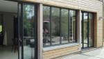 Baies vitrées coulissantes et verrière extérieure sur une extension en bois - Lille 59