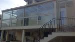 Escalier pour accéder à une véranda en aluminium