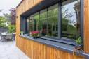 Extension maçonnée avec bardage bois et menuiserie en aluminium (Brunoy 91800)