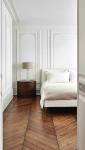 Pose d'un parquet point de Hongrie dans une chambre 