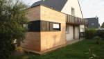Extension de maison à toit plat bois et zinc
