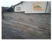Travaux de rénovation d'un mur en parpaing