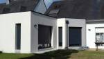 Extension de maison à toit plat béton