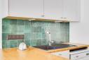 Cuisine blanche et verte : réagencement et rénovation dans un appartement lyonnais, quartier Tête d’Or