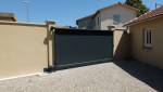 Réalisation d'un garage double avec portail coulissant, attenant à une maison existante, commune de l'ouest de Lyon : portail coulissant
