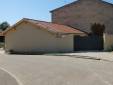 Réalisation d'un garage double avec portail coulissant, attenant à une maison existante, commune de l'ouest de Lyon : vue du garage côté rue