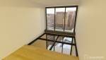 Double mezzanine bois et plancher vitré à Clichy 