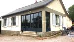 Rénovation de l'entrée d'une maison avec une verrière noire
