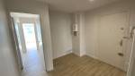 Entrée de l'appartement rénovée avec nouveau panneau électrique à Alès