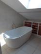 Rénovation de salle de bain dans les combles avec baignoire îlot - Ambérieu-en-Bugey 01500