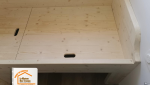 Meubles sur-mesure Crest-Voland, Bois local Savoie, Conception lit avec rangement, Expertise artisan Albertville, Optimisation espace appartement montagnard, 