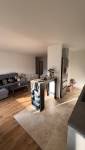 Salle de séjour ouverte sur cuisine appartement La Maison Des Travaux Ales