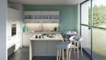 Cuisine avec baie vitrée sur le jardin à Bourdonné