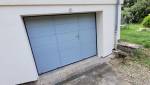Porte de garage avec portillon