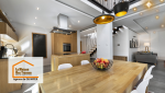Une vue globale d’une cuisine ouverte sur le salon, créant un espace convivial et moderne. 🍽️🏡