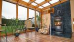 Véranda bois avec parquet sur plancher chauffante