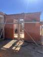 Travaux de maçonnerie en cours lors d'une construction d'extension en briques monomur - Ourches 26120