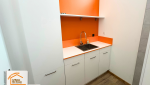 espace technique intégré, rénovation agence commerciale, salle de bain dans placard, travaux plomberie électrique, aménagement pièce invisible